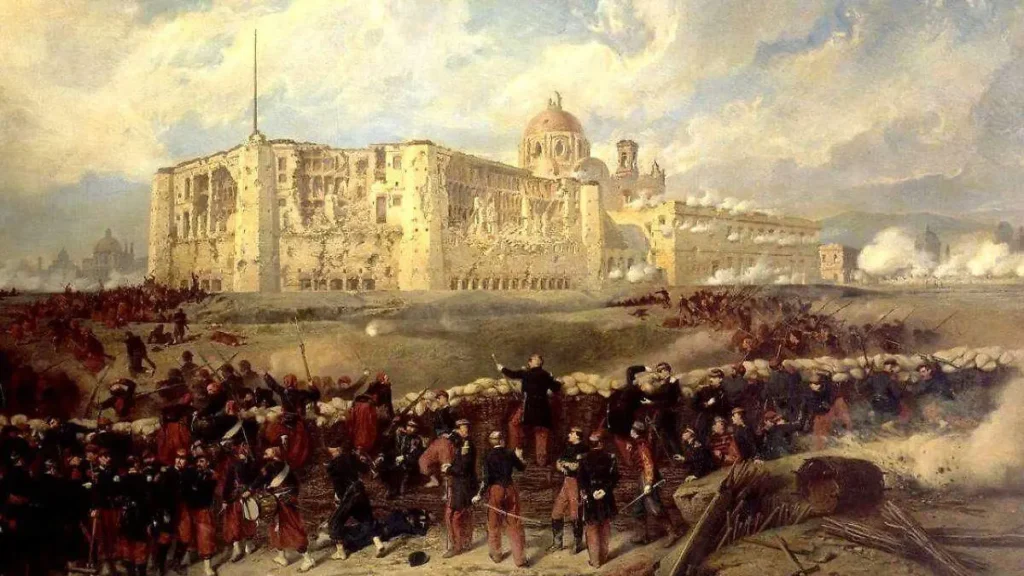 Pintura histórica de la Batalla de Puebla en 1862, con tropas mexicanas enfrentando al ejército francés frente a los fuertes de la ciudad, conmemorando el 5 de mayo.