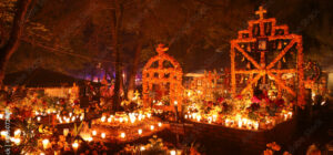 Día de muertos en Michoacán: tumbas iluminadas con velas y flores durante la noche de muertos